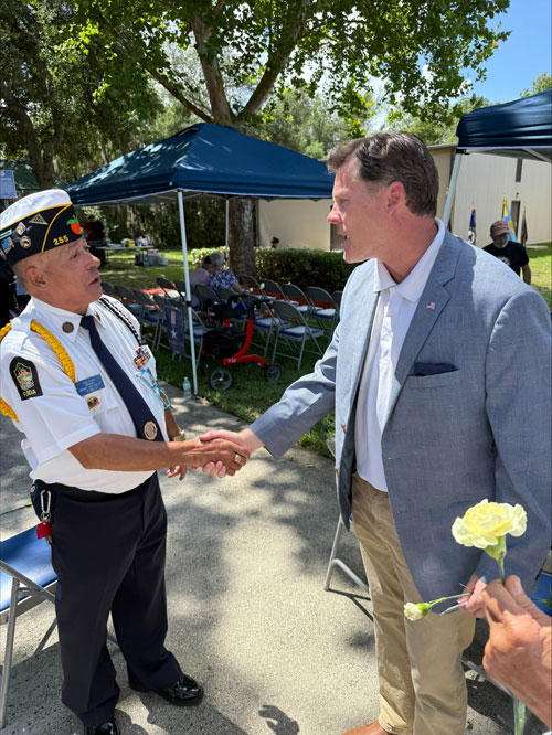 Ryan Elijah greeting a veteran at a Central Florida event