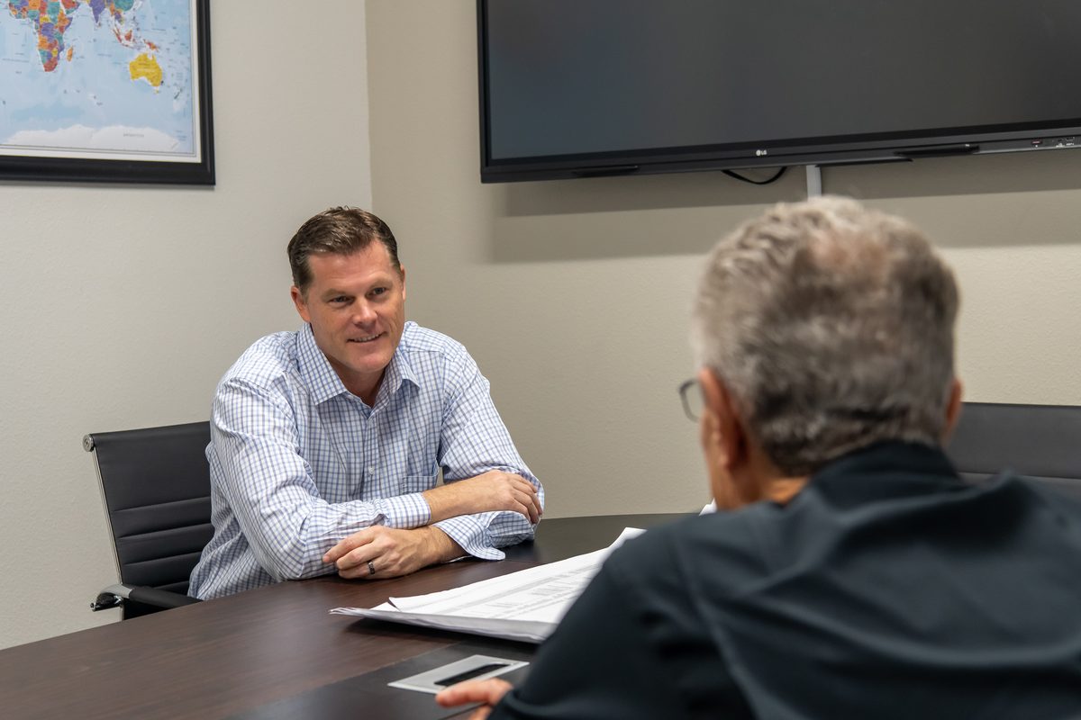Ryan Elijah meeting one-on-one with a Central Florida business owner